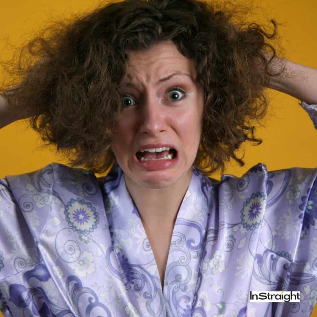 a girl with frizzy hair, how hot does a hair straightener get